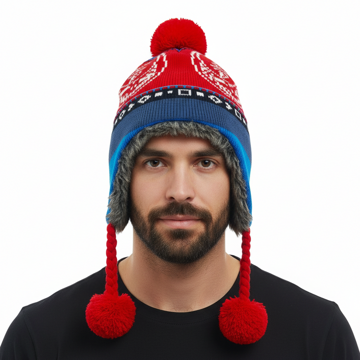Red and blue knitted hat with pom-poms on a white background